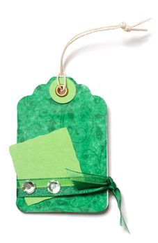 Green Price Tag with Ribbon and Decoration on White Background - Handmade