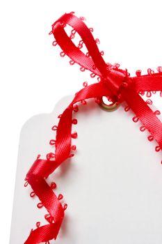 Price Tag with Red Ribbon on White Background