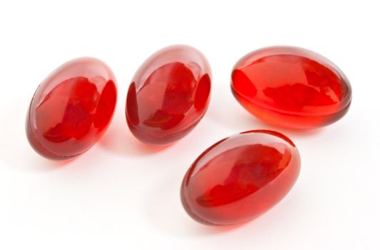 Red Gel Capsules isolated on white background