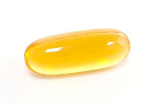 Yellow gel capsule isolated on white background