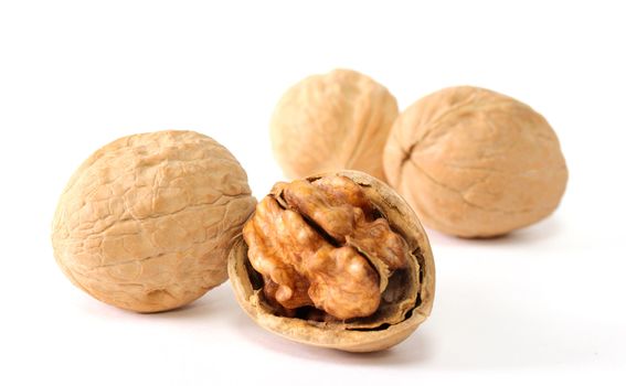 Walnuts in shells isolated on white background
