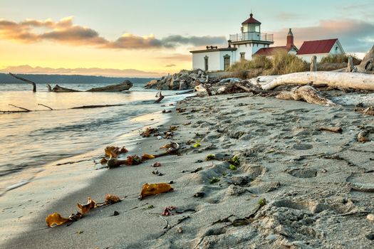 Sun setting on the West Point Lighthouse  at Seattle, Washington