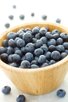 Fresh blueberries in wooden bowl