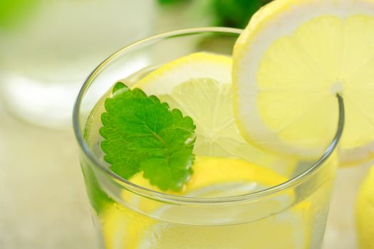 glass of lemonade with lemon and mint