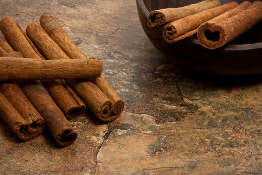 Cinnamon sticks on stone table