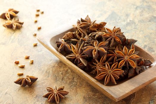 Star Anise on wooden plate