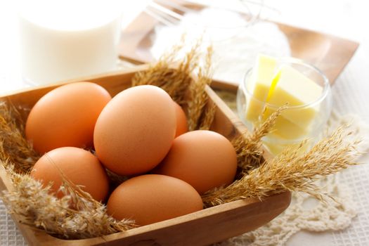 Cake making ingredients - eggs, butter, milk and flour