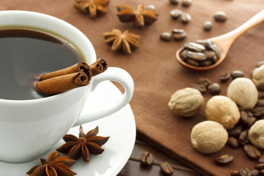 Cup of coffee with assortment of spices