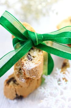 Biscotti with powdered sugar and green ribbon