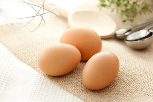 Eggs with kitchen utensils with thyme