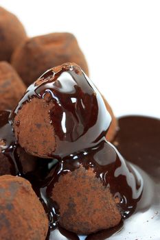 Chocolate truffle covered with chocolate syrup