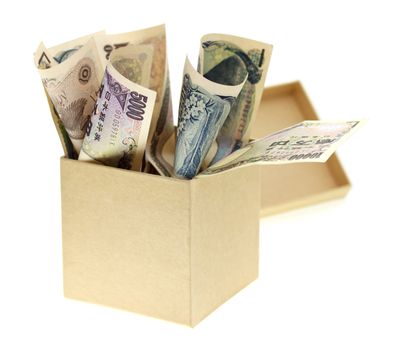 Japanese yen bank notes in the box on white background