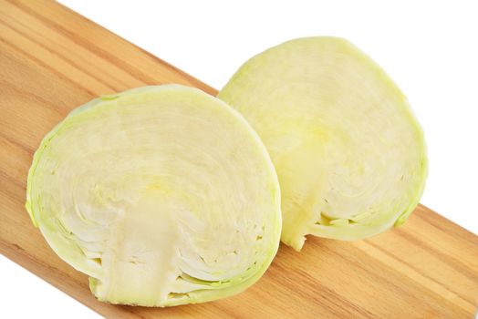 Cabbage on a cutting board. Isolated on white.