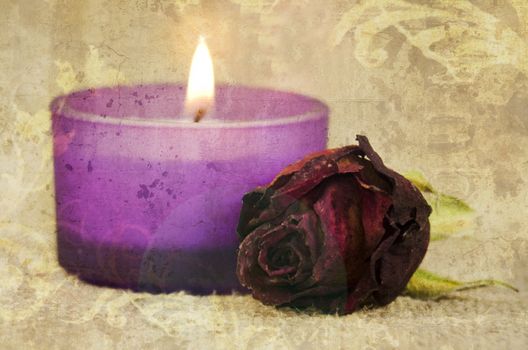 rose and candle on textured background