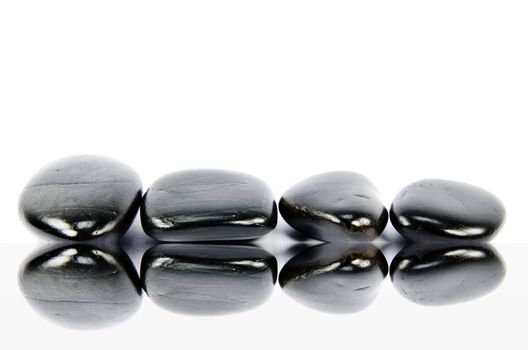 black pebbles on white background