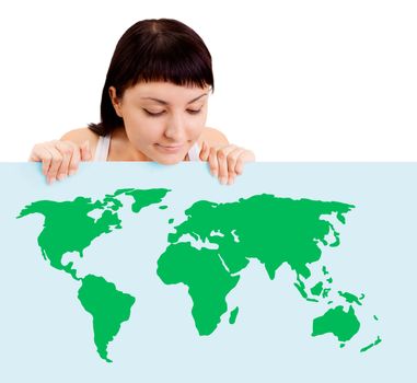 Woman smiling showing earth globe on billboard