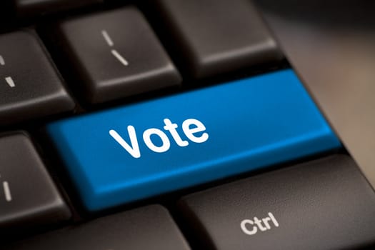 democracy concept with vote button on keyboard