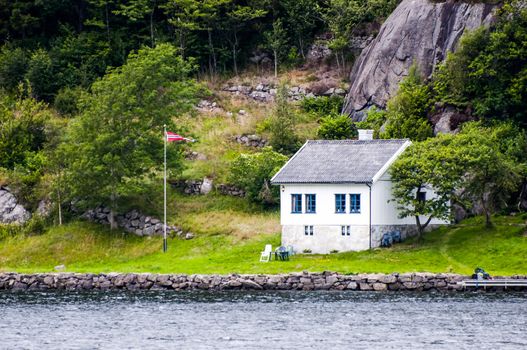 Lone house in remote location on fjord