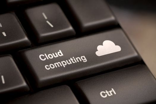 Cloud computing concept showing cloud icon on computer key.