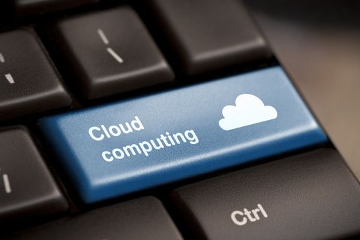 Cloud computing concept showing cloud icon on computer key.