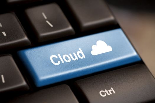 Cloud computing concept showing cloud icon on computer key.