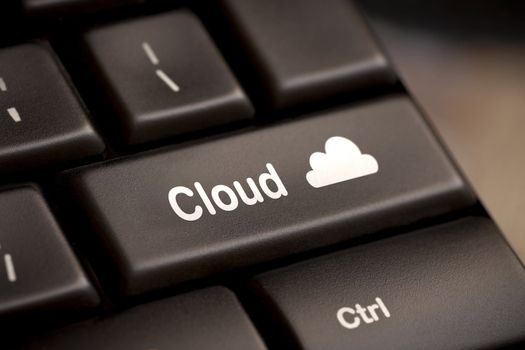 Cloud computing concept showing cloud icon on computer key.