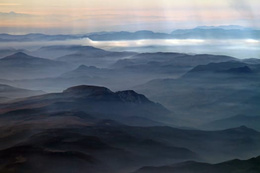 Misty mountain range with nice light rays