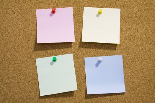 Blank notes pinned on corkboard ready for your text.