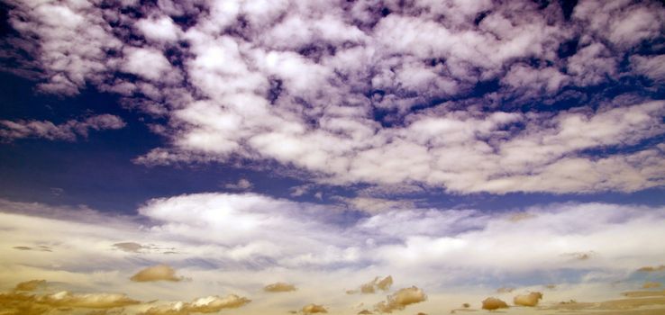 blue sky with clouds and sun