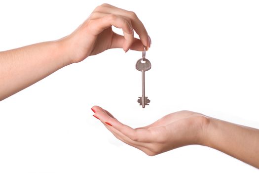 Human hands and key isolated on white background