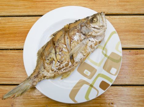 Fried fish on dish, delicious thai food