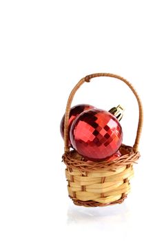 Red ball in basket Christmas decorations isloated on white