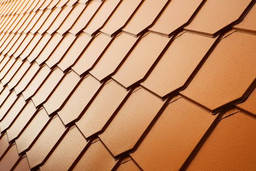 Unusual rows of a copper tile wall in perspective