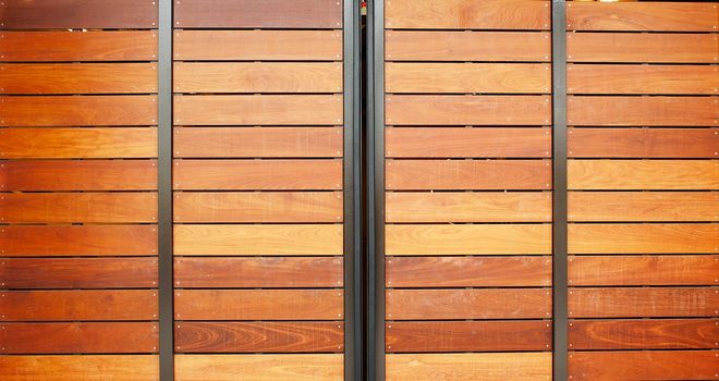 Stained wood framed in steel garage doors horizontal