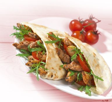 greek chicken souvlaki in pitta served in plate