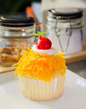 gold egg yolks thread with cherry and cream  cake, sweet dessert 
