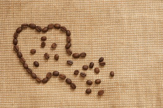 love symbol made of coffee beans ruptured