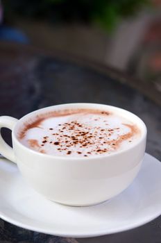 hot cappuccino  in white coffee cup