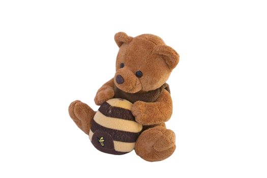 A brown teddy bear with a bee house