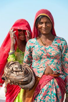 Sambhar, India - Nov 19: Portrait of indian female workers in salt farm on Nov 19, 2012 in Sambhar Salt Lake, India. It is India's largest saline lake and where salt has been farmed for a thousand years. 