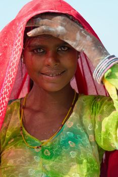Sambhar, India - Nov 19: Portrait of indian female worker in salt farm on Nov 19, 2012 in Sambhar Salt Lake, India. It is India's largest saline lake and where salt has been farmed for a thousand years. 