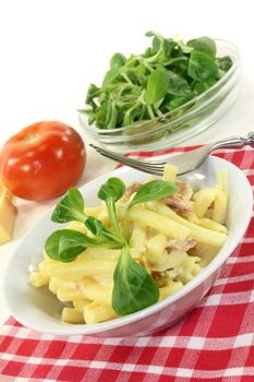 Pasta Carbonara with ham and corn salad