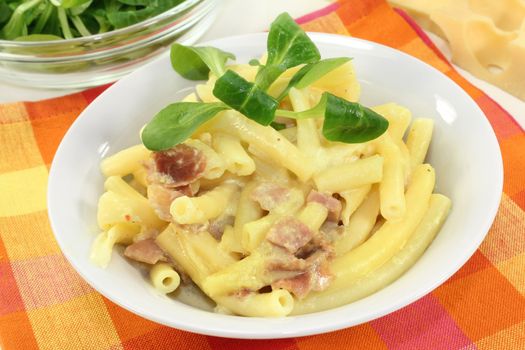 Pasta Carbonara with ham and corn salad