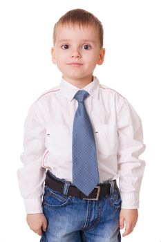 Calm clever preschool kid in shirt and jeans isolated on white background