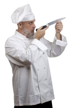 Portrait of a caucasian chef in his uniform on a white background.