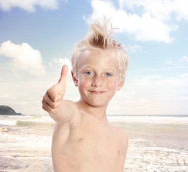 Young Blonde Boy Giving Thumbs Up at the Beach