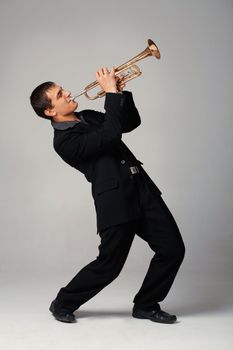 Portrait of a young man playing his Trumpet