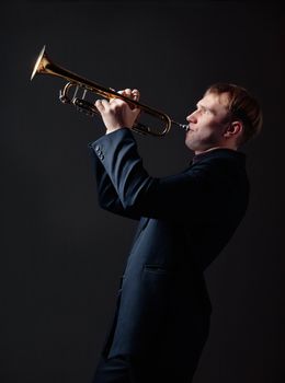 Portrait of a young man playing his Trumpet