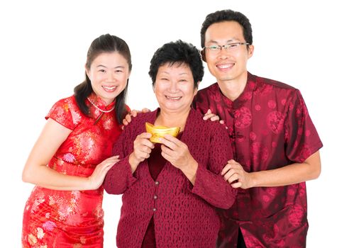 Happy Chinese New Year. Asian Chinese family greeting, holding a gold ingot isolated on white background
