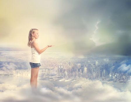 Blonde Girl  Holding Hand Out with Palm Up on the Clouds Above the City